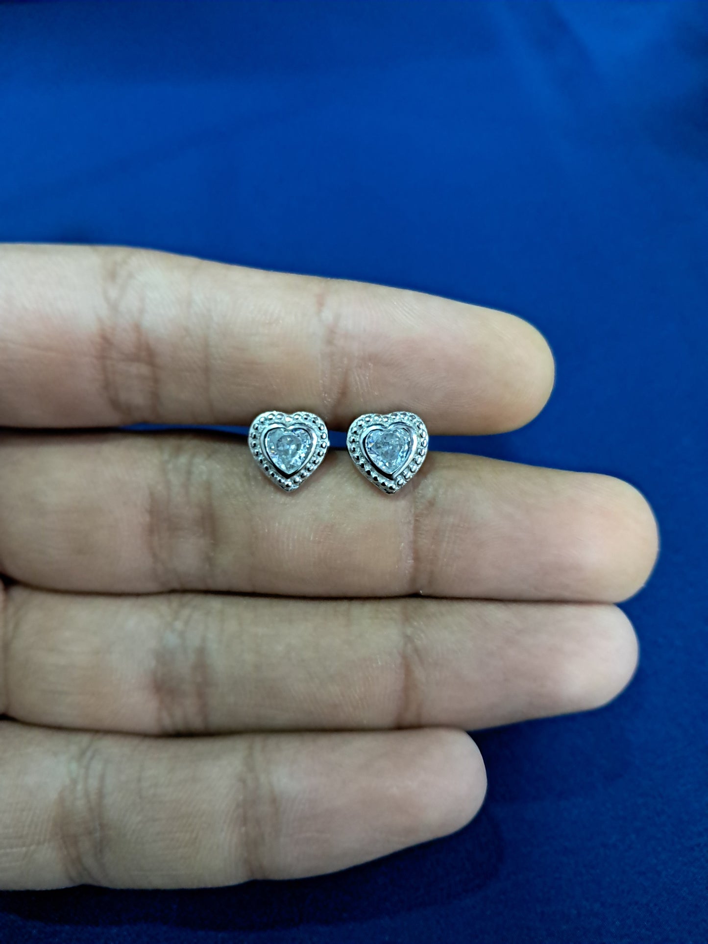 Heart with studded diamonds silver earrings