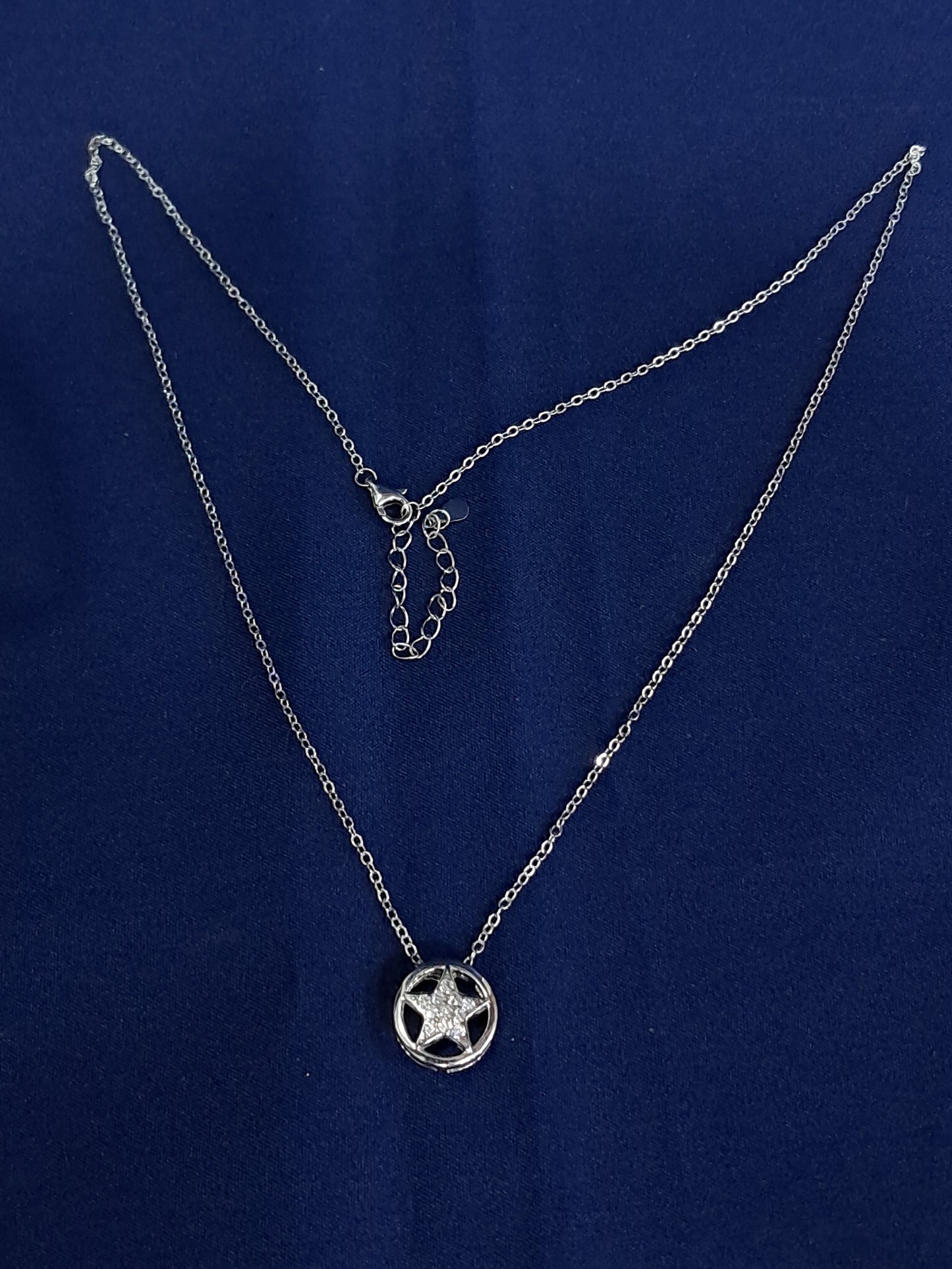 Silver Star shaped pendant with a border and classic chain