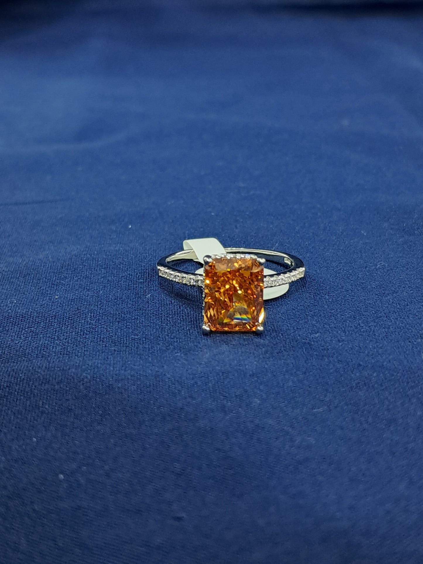 Orange dashing solitaire ring