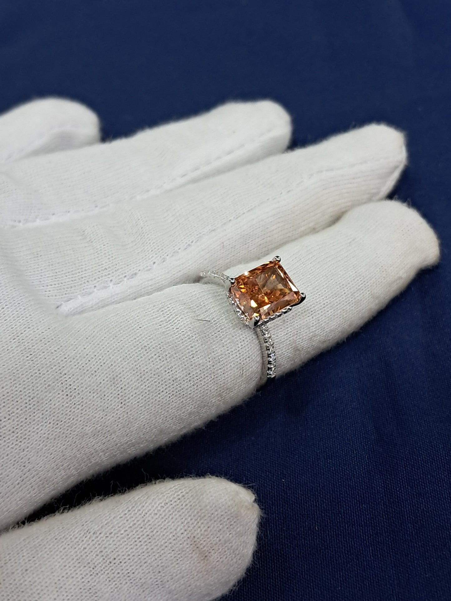 Orange dashing solitaire ring